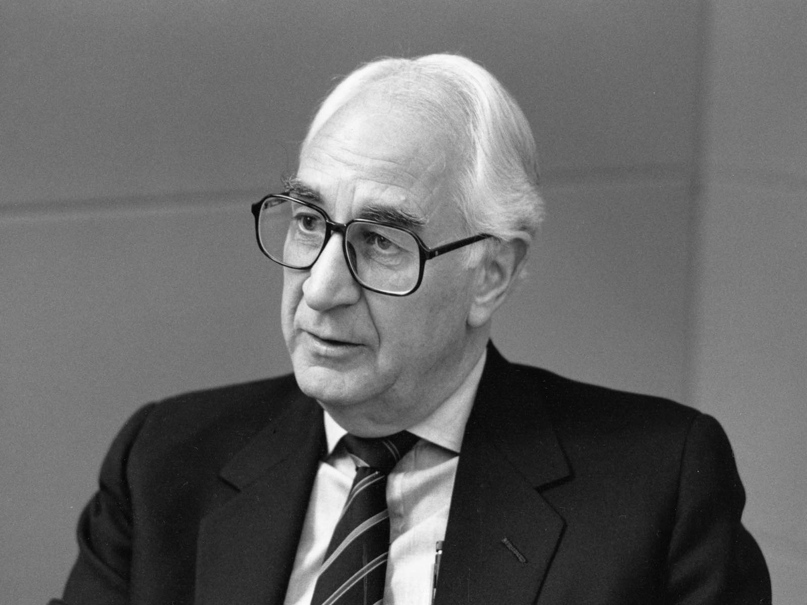 A black-and-white photo of former Herman Miller CEO Max De Pree.