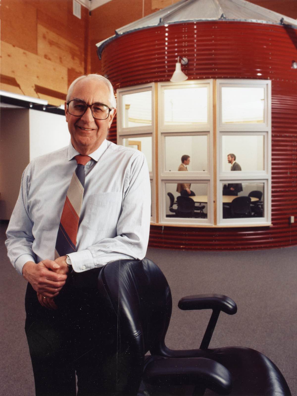 Former Herman Miller CEO Max De Pree leans on a chair in Herman Miller's Design Yard facility in Holland, Michigan.